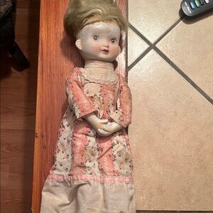 Vintage  bisque Doll with a long Floral  pink and white Dress